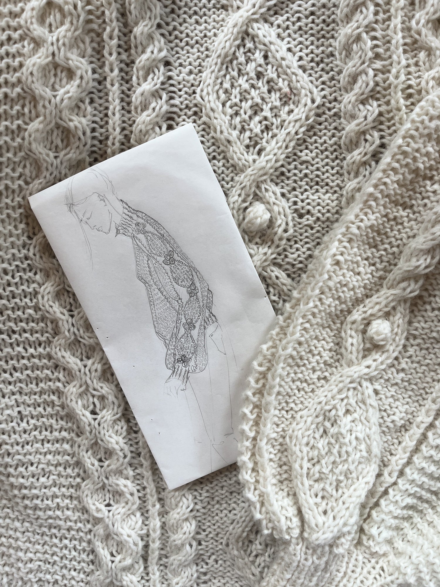 Naturally luxurious hand knit cream cable sweater and detailed designer sketch by BAWN 